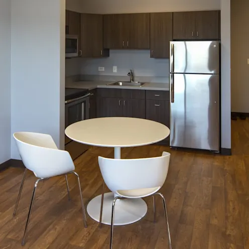 room with table and kitchenette area room with table and kitchenette area