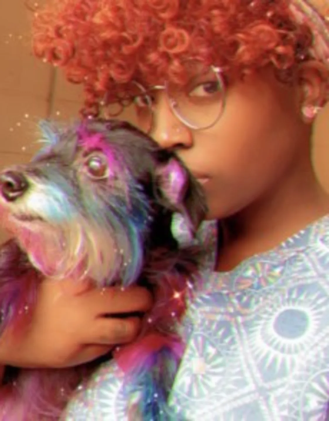 Erika, holding a dog with colorful hair Erika, holding a dog with colorful hair