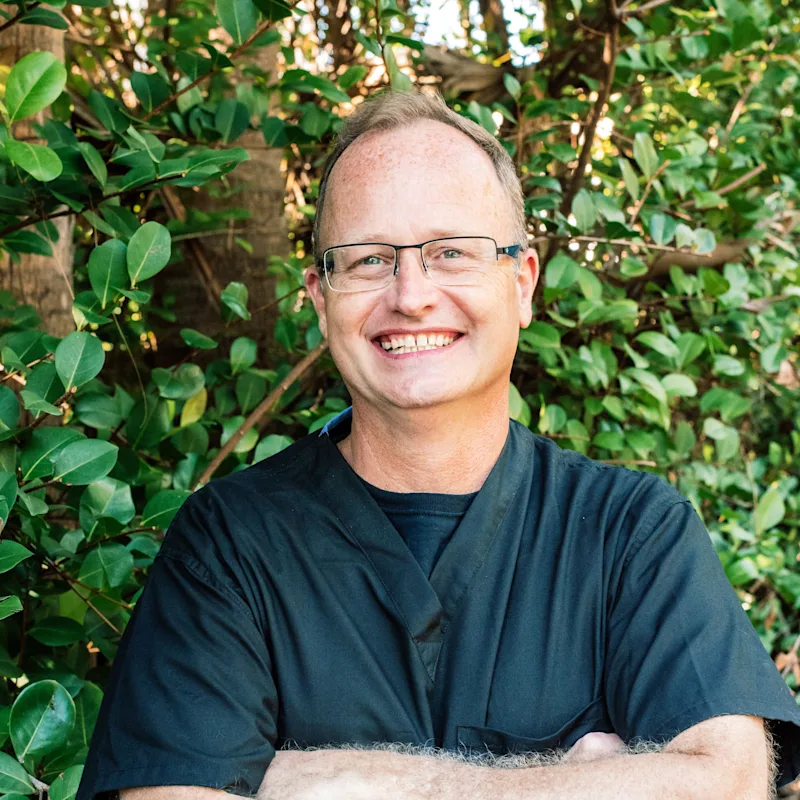Dr. Steve Hanson hugging a big dog Dr. Steve Hanson hugging a big dog