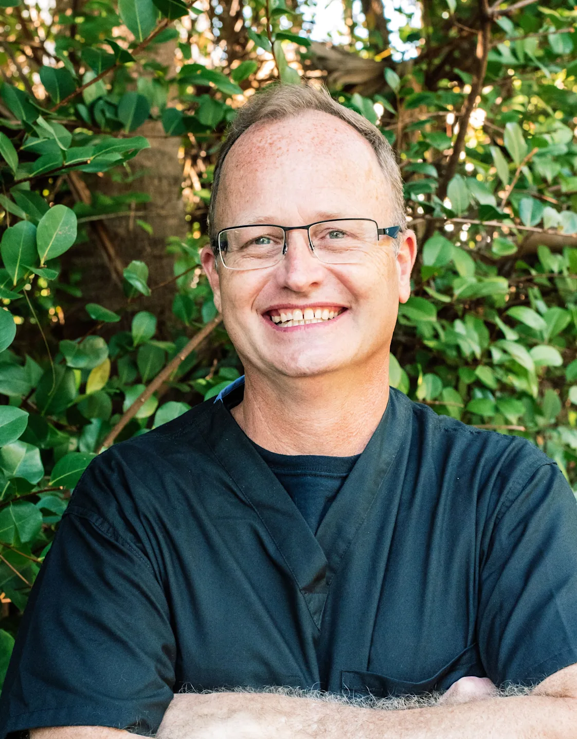 Dr. Steve Hanson hugging a big dog Dr. Steve Hanson hugging a big dog