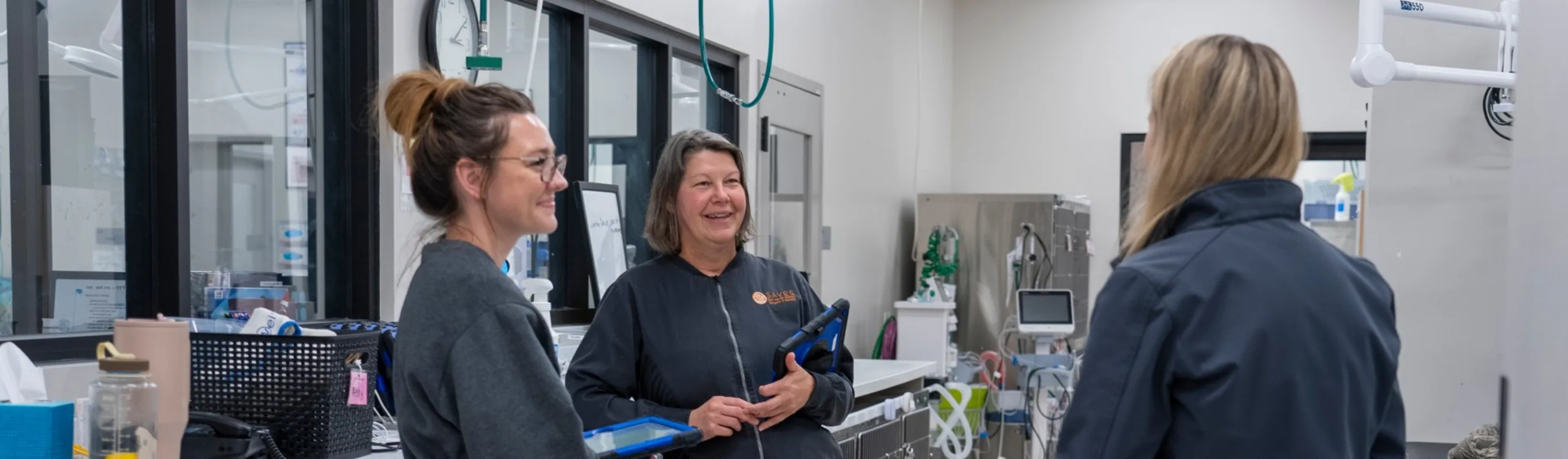 Staff standing around and talking Staff standing around and talking