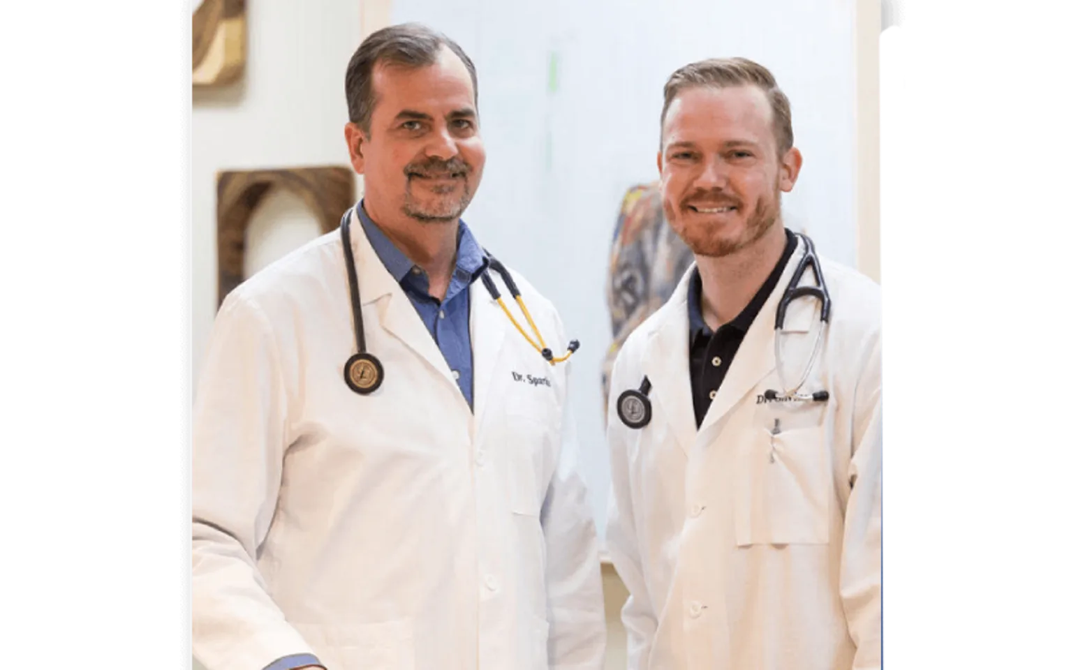 Two veterinarians posing for a photo Two veterinarians posing for a photo