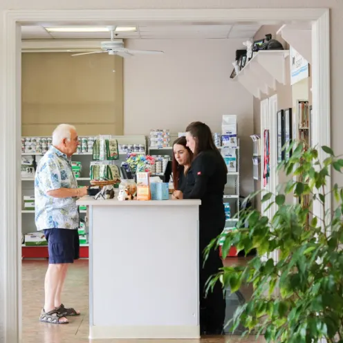 Front desk staff helping pet owner at Brentwood Family Pet Care