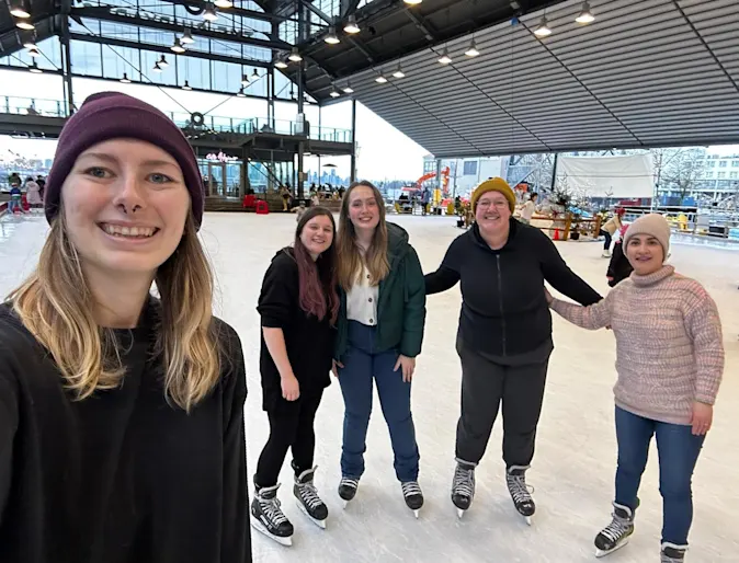 Staff selfie at a ice skating rink