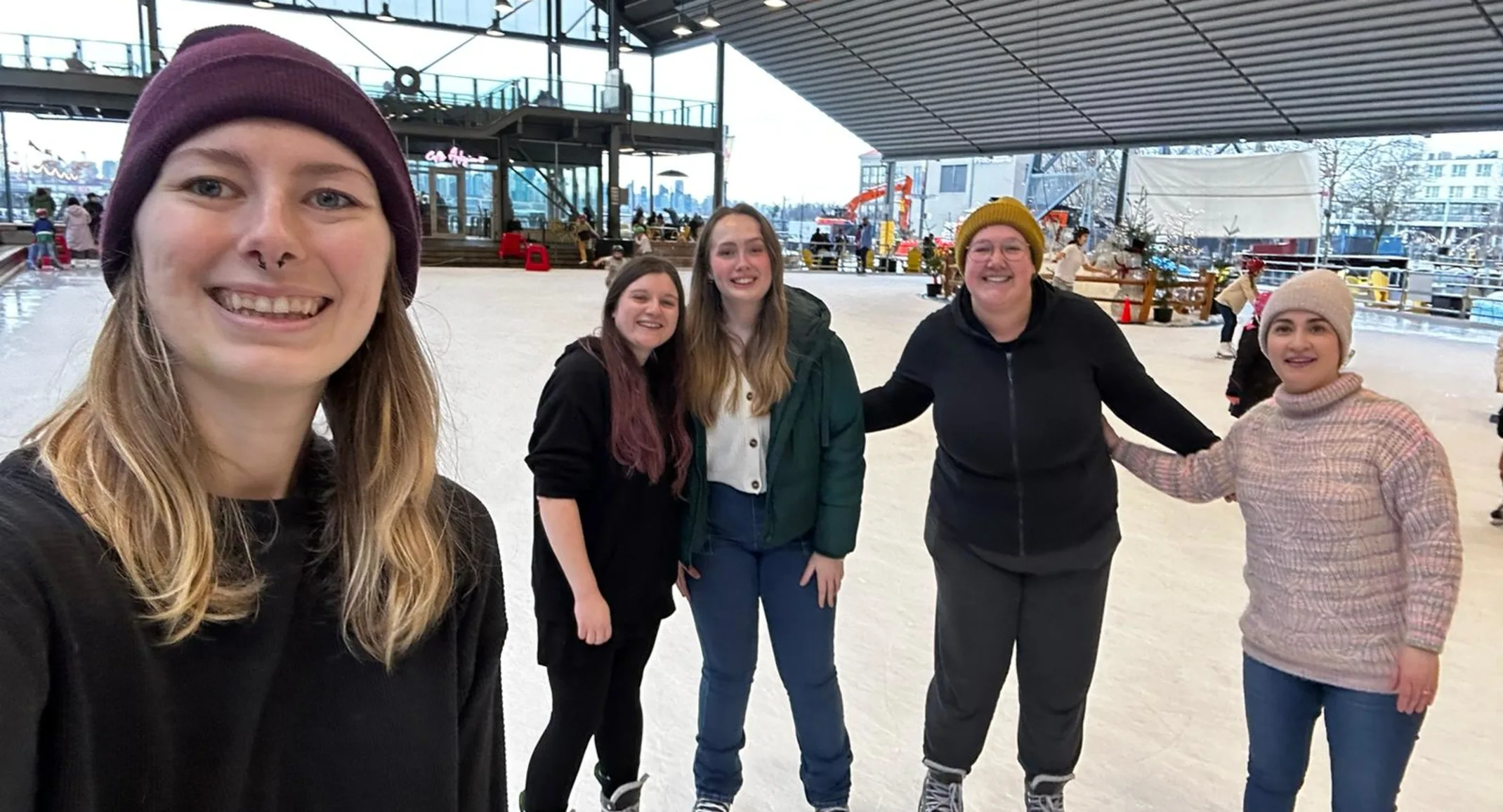 Staff selfie at a ice skating rink