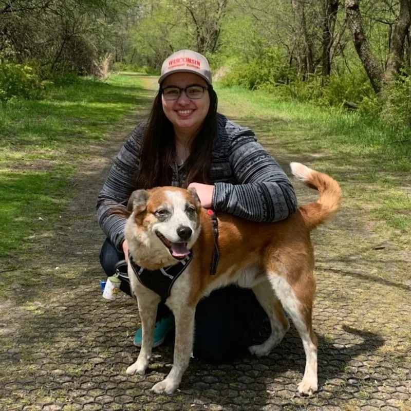 Dr. Katarzyna Gibas' staff photo from Elmwood Grove Animal Hospital where she is sitting next to her dog on a hiking trail. Dr. Katarzyna Gibas' staff photo from Elmwood Grove Animal Hospital where she is sitting next to her dog on a hiking trail.