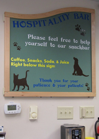 Poquoson Veterinary Hospital Snack Bar signage letting clients know to help themselves to their snackbar. They offer coffee, soda, and snacks.