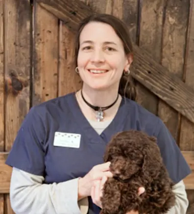 A director posing with a dog A director posing with a dog