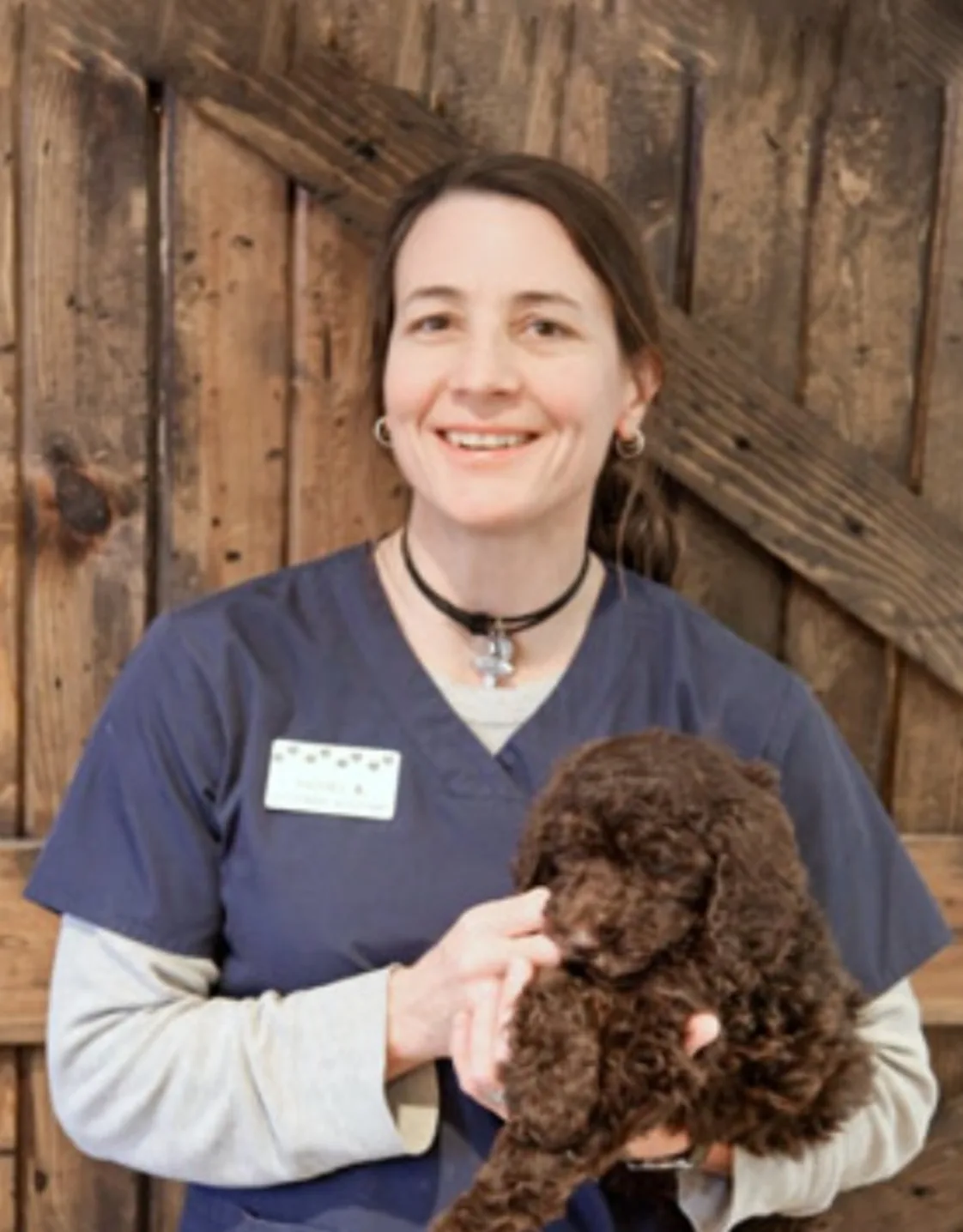 A director posing with a dog A director posing with a dog