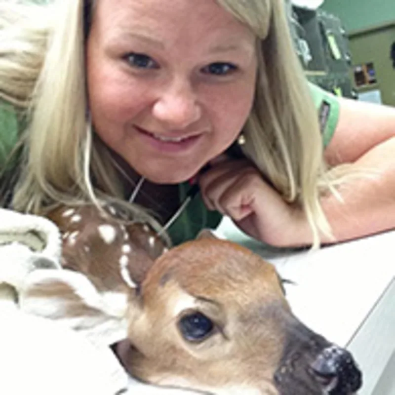 Dr. Haley Rush Hanks with a deer Dr. Haley Rush Hanks with a deer