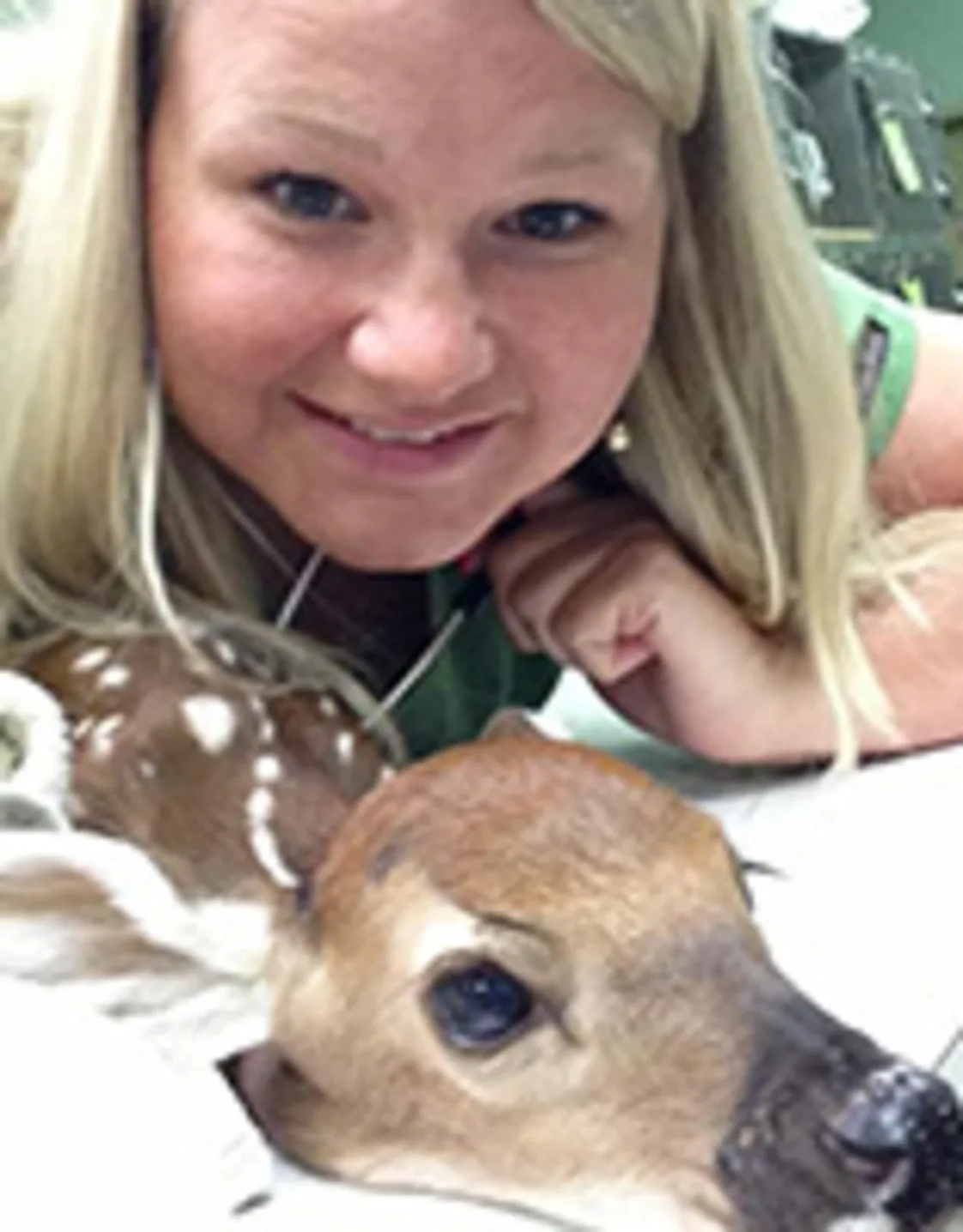 Dr. Haley Rush Hanks with a deer Dr. Haley Rush Hanks with a deer