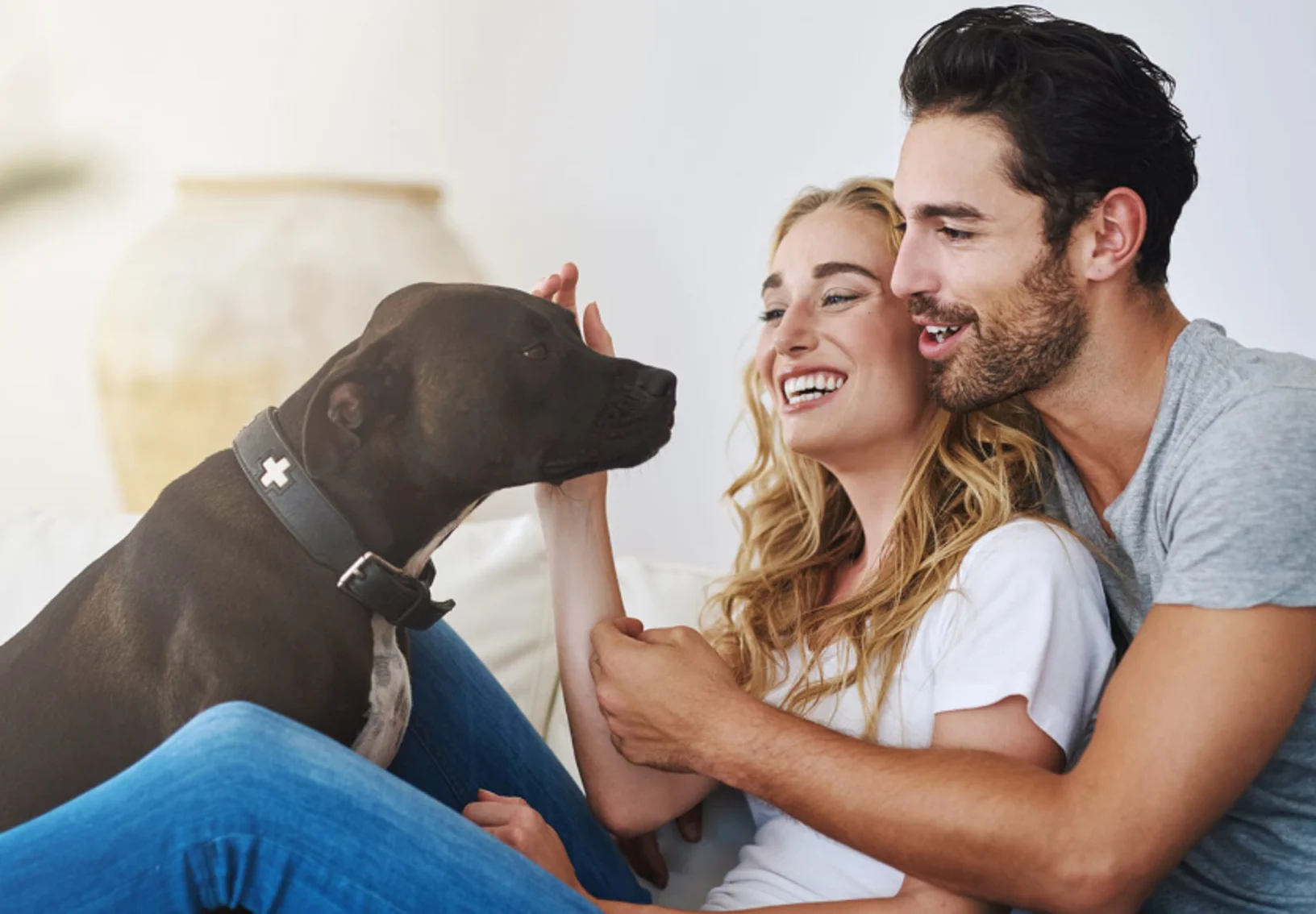 Couple with Black Dog at Home Couple with Black Dog at Home