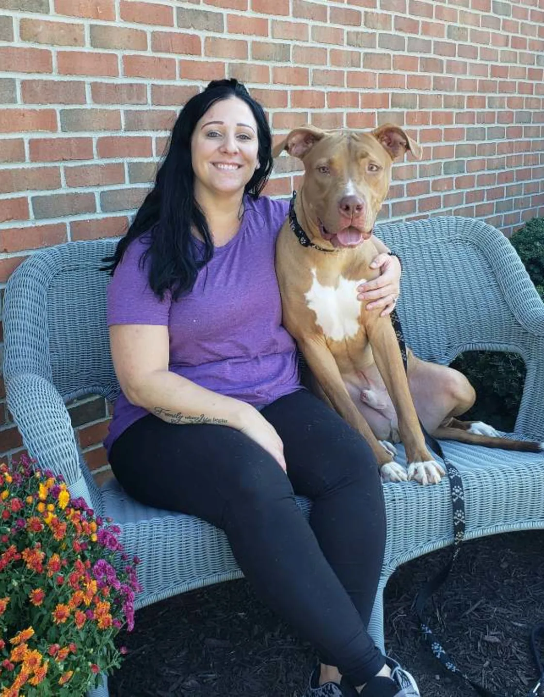 Kettering Animal Hospital's Megan L posing with a dog Kettering Animal Hospital's Megan L posing with a dog