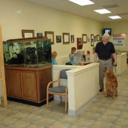 Patients and their owners sitting in the lobby area.