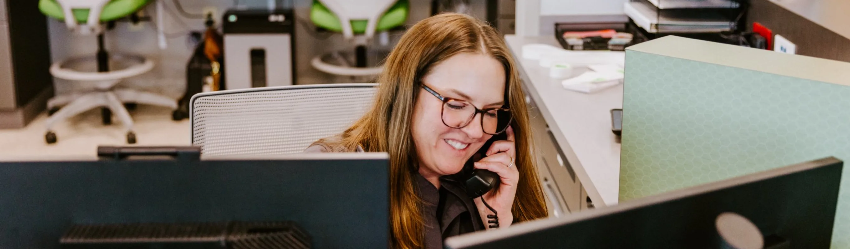Receptionist talk on the phone with a client. Receptionist talk on the phone with a client.