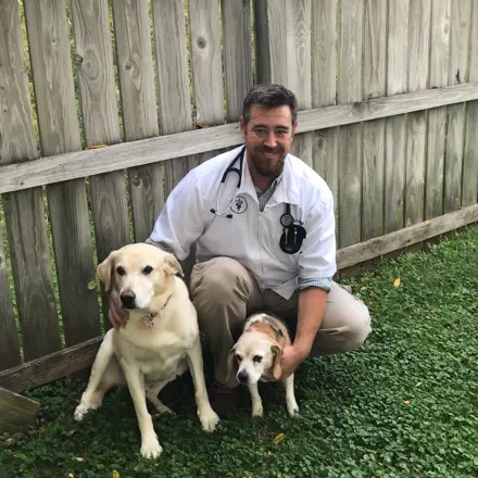 Matthew A. Watrud with two dogs