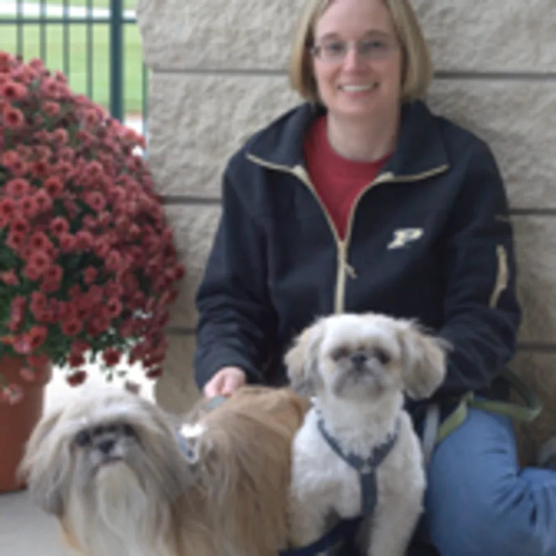 Lisa sitting with two dogs Lisa sitting with two dogs
