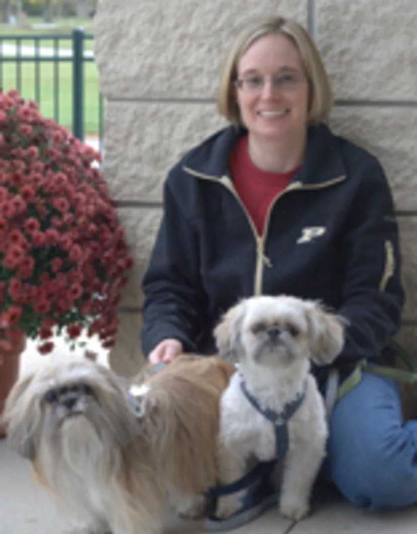 Lisa sitting with two dogs