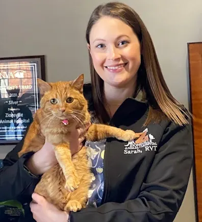 Sarah holding an orange tabby Sarah holding an orange tabby