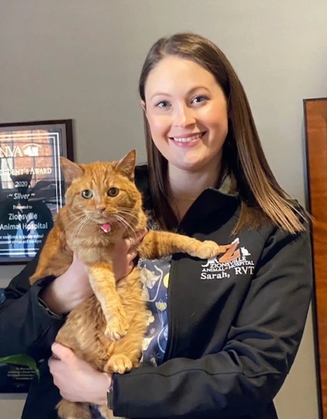 Sarah holding an orange tabby Sarah holding an orange tabby