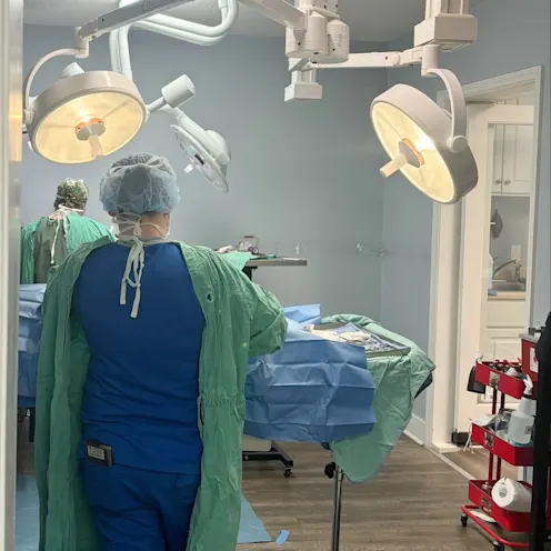 Staff operating in surgery suite Staff operating in surgery suite