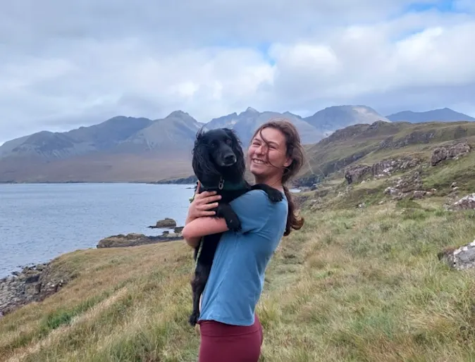Dr. Lucy Cundall holding a dog Dr. Lucy Cundall holding a dog