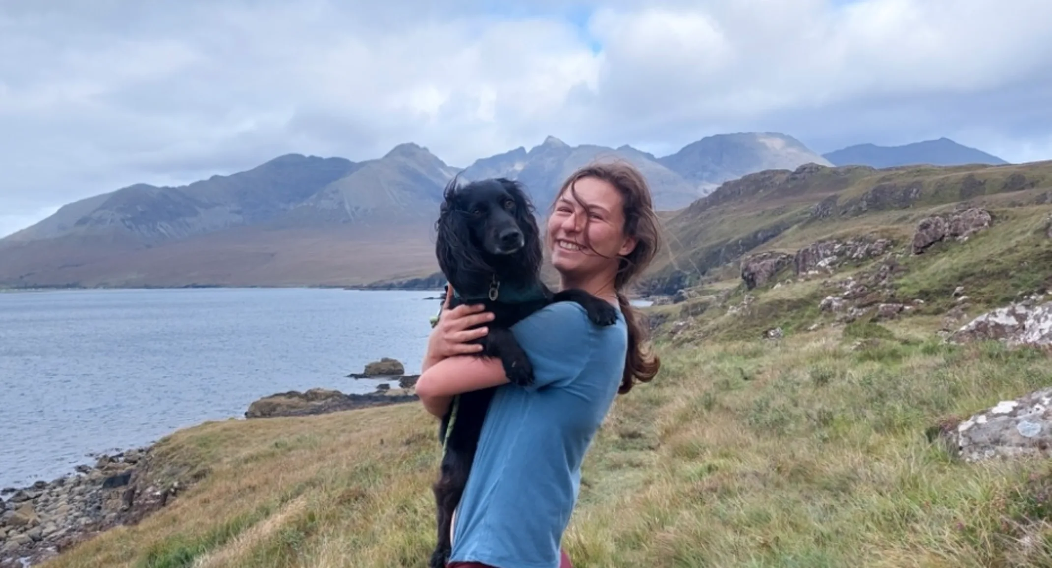 Dr. Lucy Cundall holding a dog Dr. Lucy Cundall holding a dog