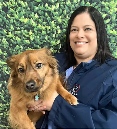 Christie's staff photo from Spanish Trail Animal Hospital where she is posing with a shih tzu Christie's staff photo from Spanish Trail Animal Hospital where she is posing with a shih tzu