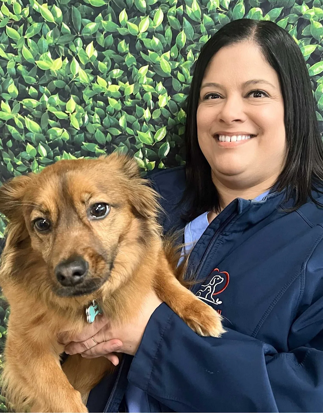 Christie's staff photo from Spanish Trail Animal Hospital where she is posing with a shih tzu Christie's staff photo from Spanish Trail Animal Hospital where she is posing with a shih tzu