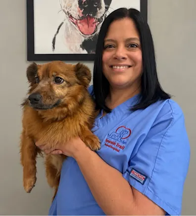 Christie's staff photo from Spanish Trail Animal Hospital where she is posing with a shih tzu Christie's staff photo from Spanish Trail Animal Hospital where she is posing with a shih tzu