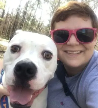 Portrait of Ashley with white dog 