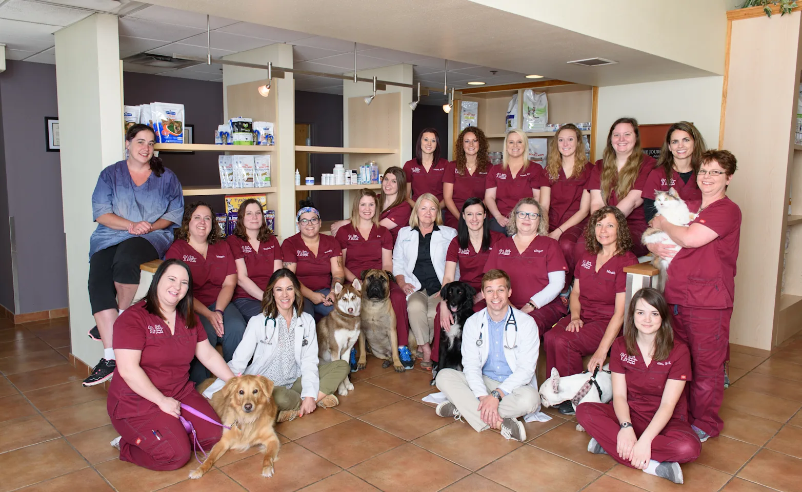 Group Photo of veterinary staff in burgundy scrubs at South Suburban Animal Hospital Group Photo of veterinary staff in burgundy scrubs at South Suburban Animal Hospital