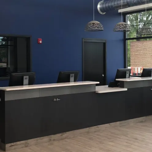 Reception desk and blue wall at Carriage Animal Hospital