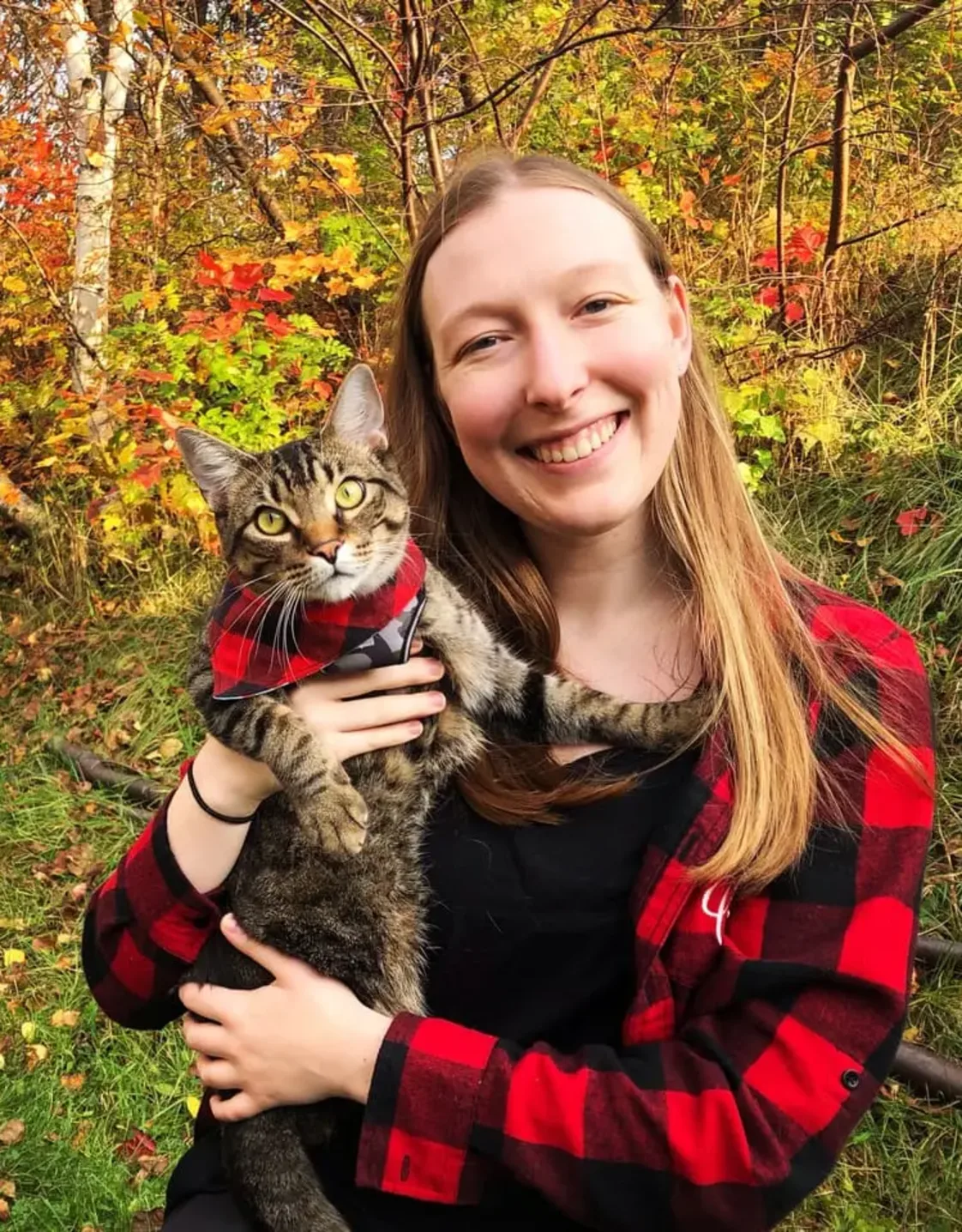 Staff photo of Dr. Cassia Michel holding a cat Staff photo of Dr. Cassia Michel holding a cat