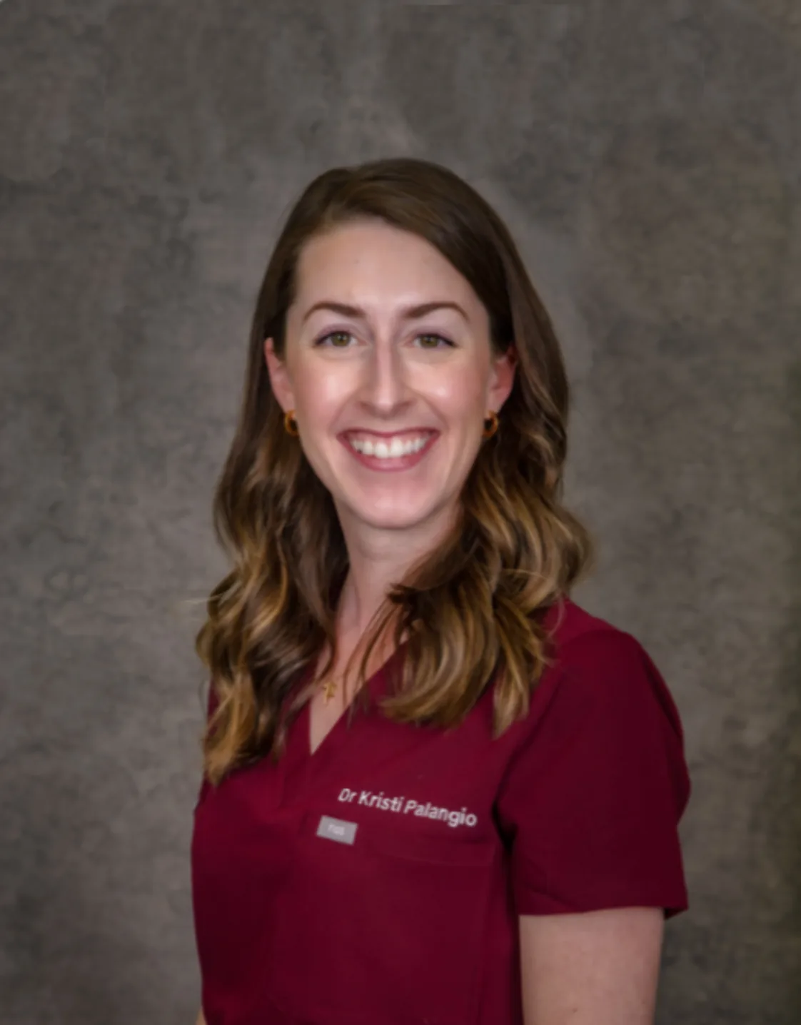 Dr. Kristi Palangio smiling at the camera Dr. Kristi Palangio smiling at the camera