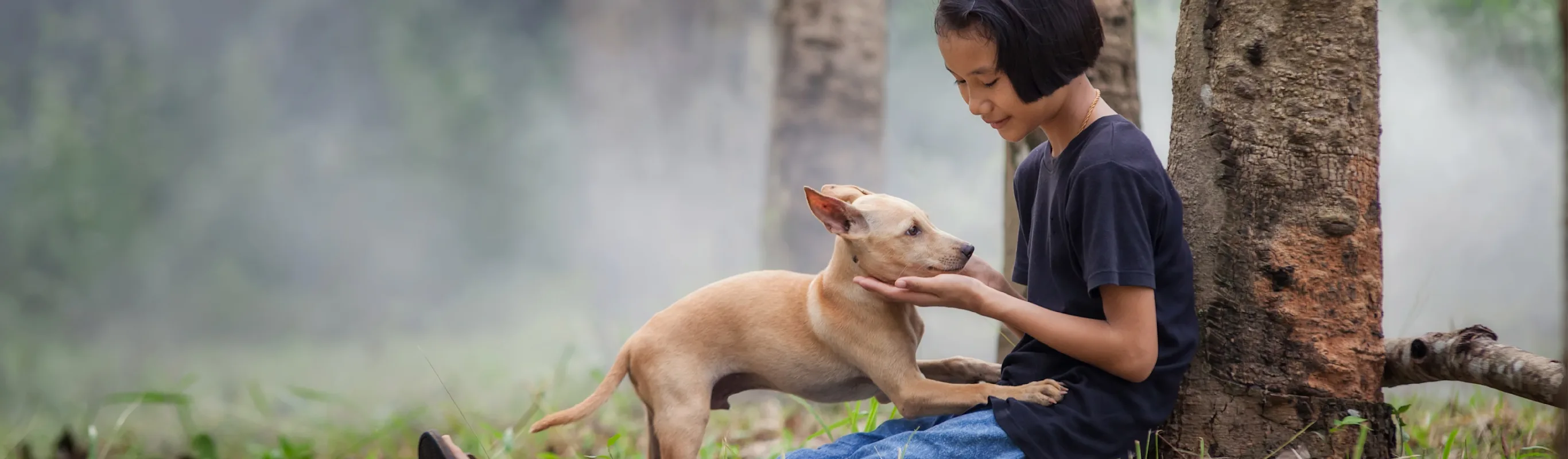 girl with a dog in the forest