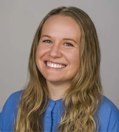 A photo of Dr. Hoff smiling in a grassy area A photo of Dr. Hoff smiling in a grassy area