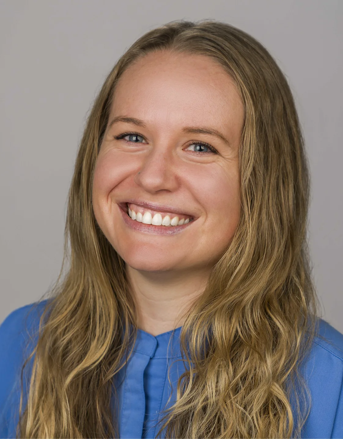 A photo of Dr. Hoff smiling in a grassy area A photo of Dr. Hoff smiling in a grassy area