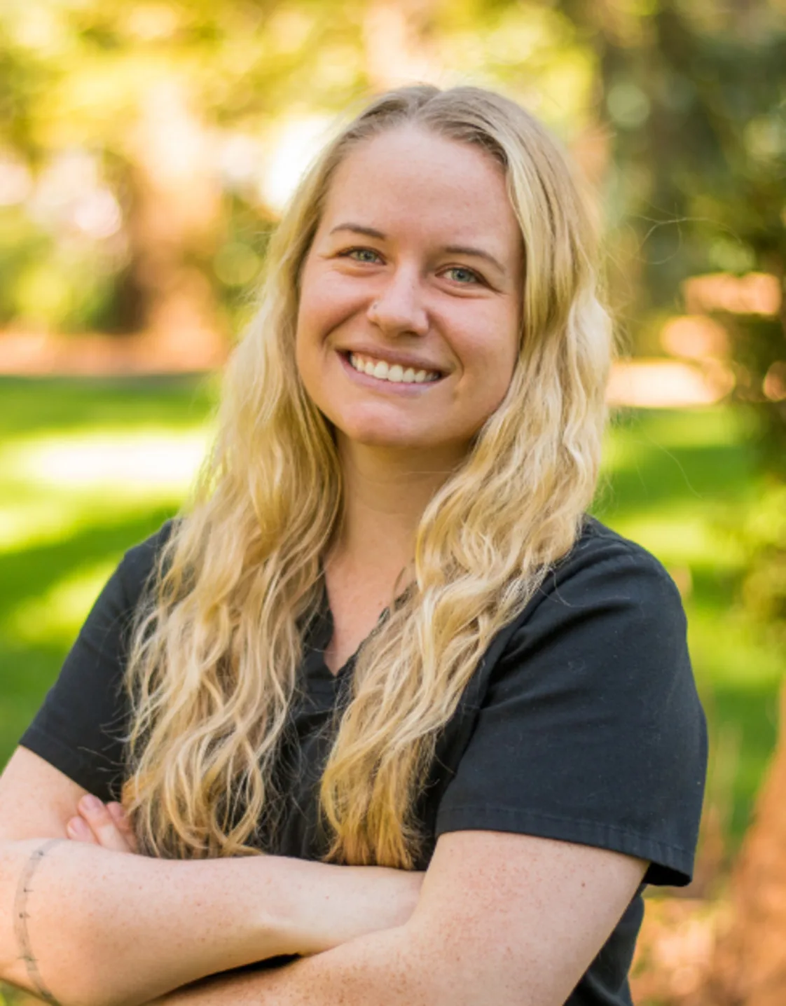 A photo of Dr. Hoff smiling in a grassy area A photo of Dr. Hoff smiling in a grassy area