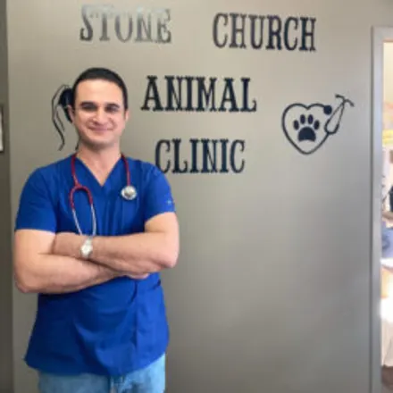 Dr. Saeid Ghiasi in front of the clinic sign