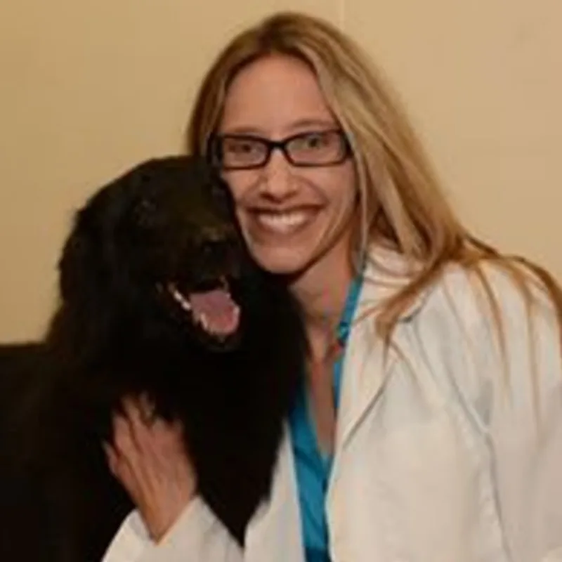Dr. Dana Nelson with black dog Dr. Dana Nelson with black dog