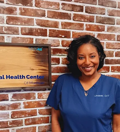 Lindsey Gaines of Animal Health Center of Madison holding black and white cat Lindsey Gaines of Animal Health Center of Madison holding black and white cat