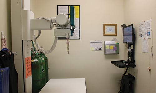 An xray machine and table inside Evergreen Veterinary Clinic