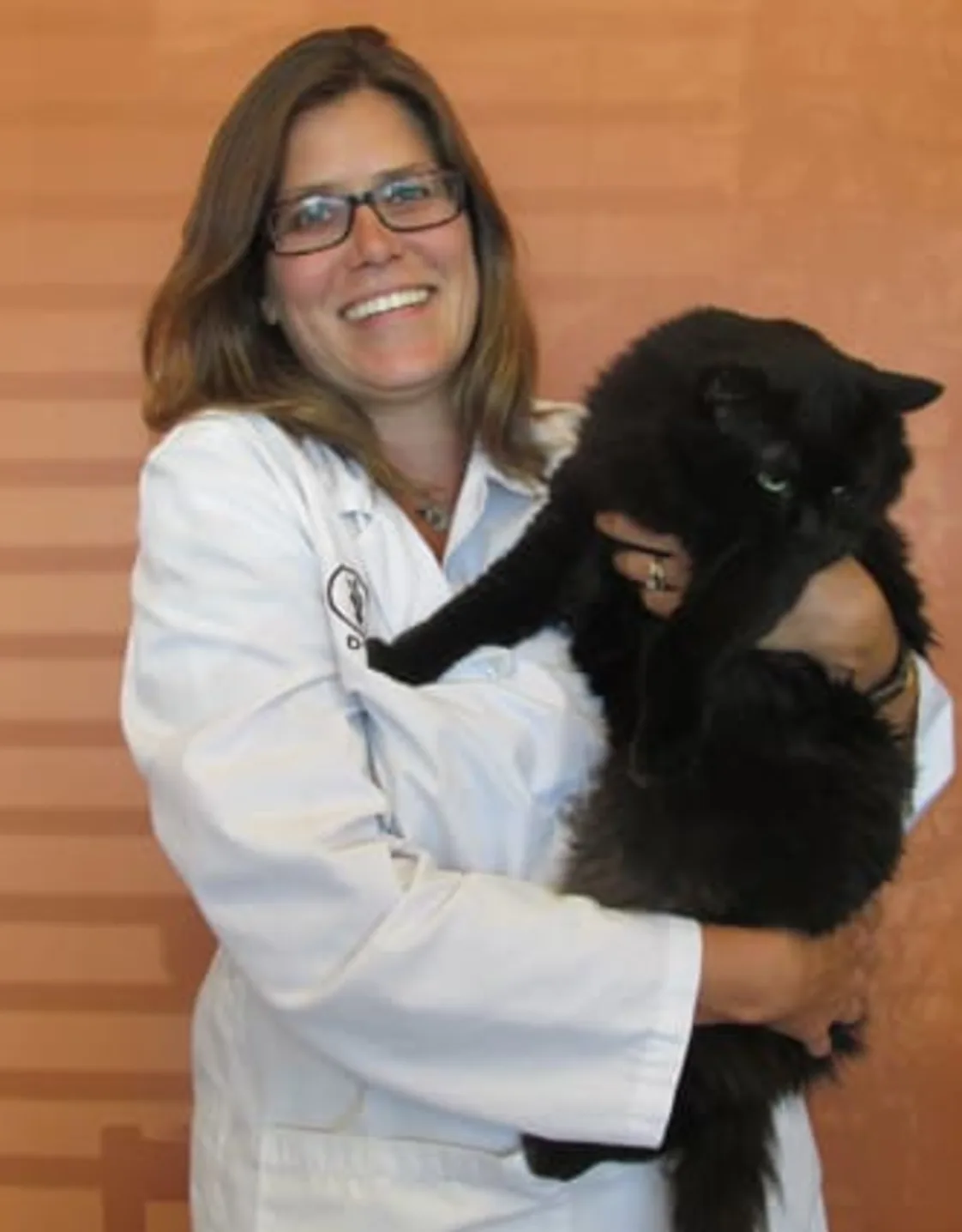 Dr. Lisa Fritsch holding big black cat at Lake Street Animal Hospital Dr. Lisa Fritsch holding big black cat at Lake Street Animal Hospital