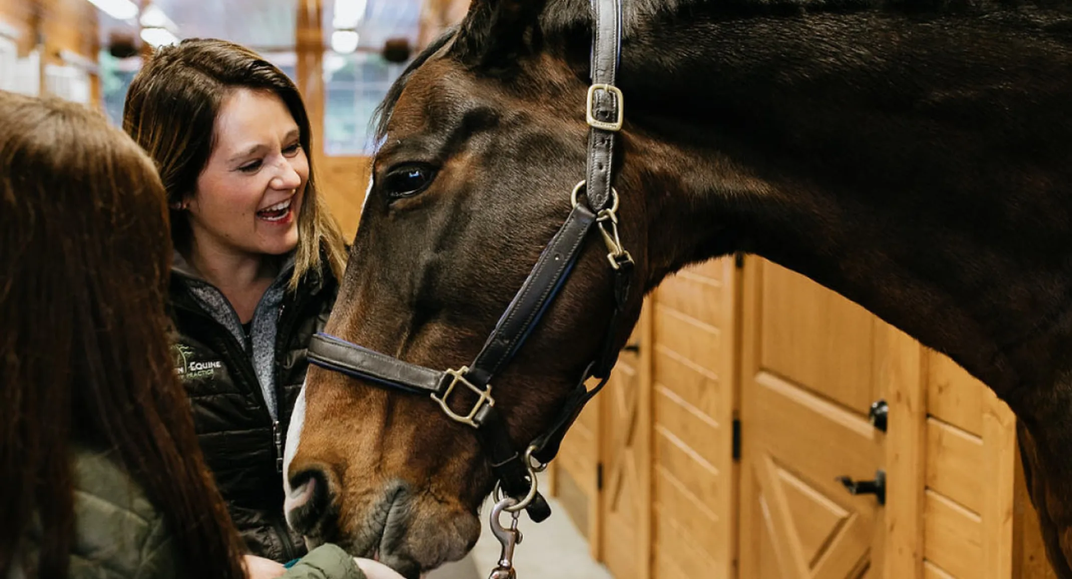 Two Evergreen Equine Veterinary Practice staff members with a horse Two Evergreen Equine Veterinary Practice staff members with a horse