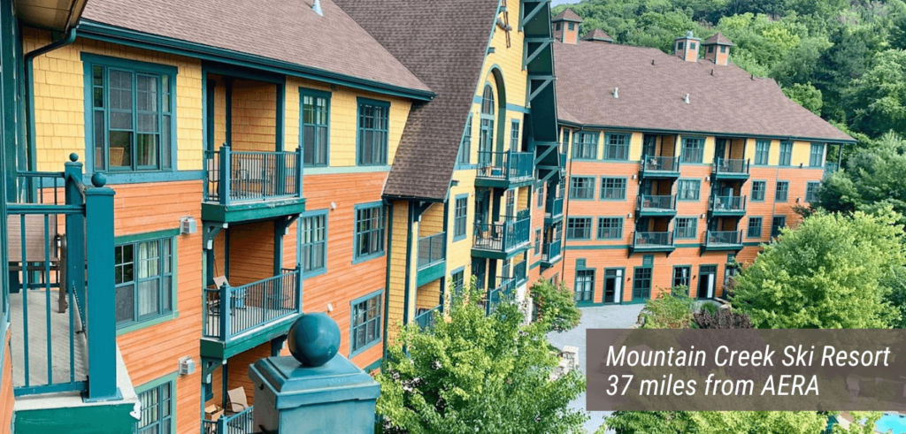 An image of the Mountain Creek Ski Resort with text stating "Mountain Creek Ski Resort 37 miles from AERA".