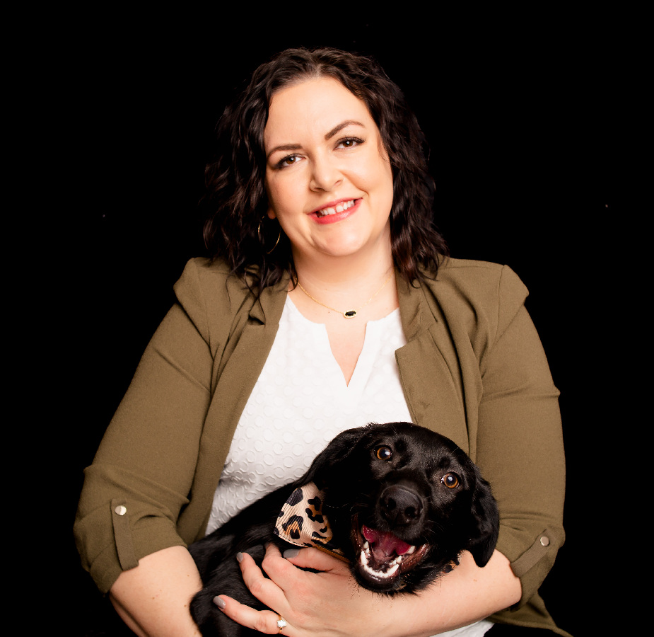 A Kindness Animal Hospital staff member with a dog