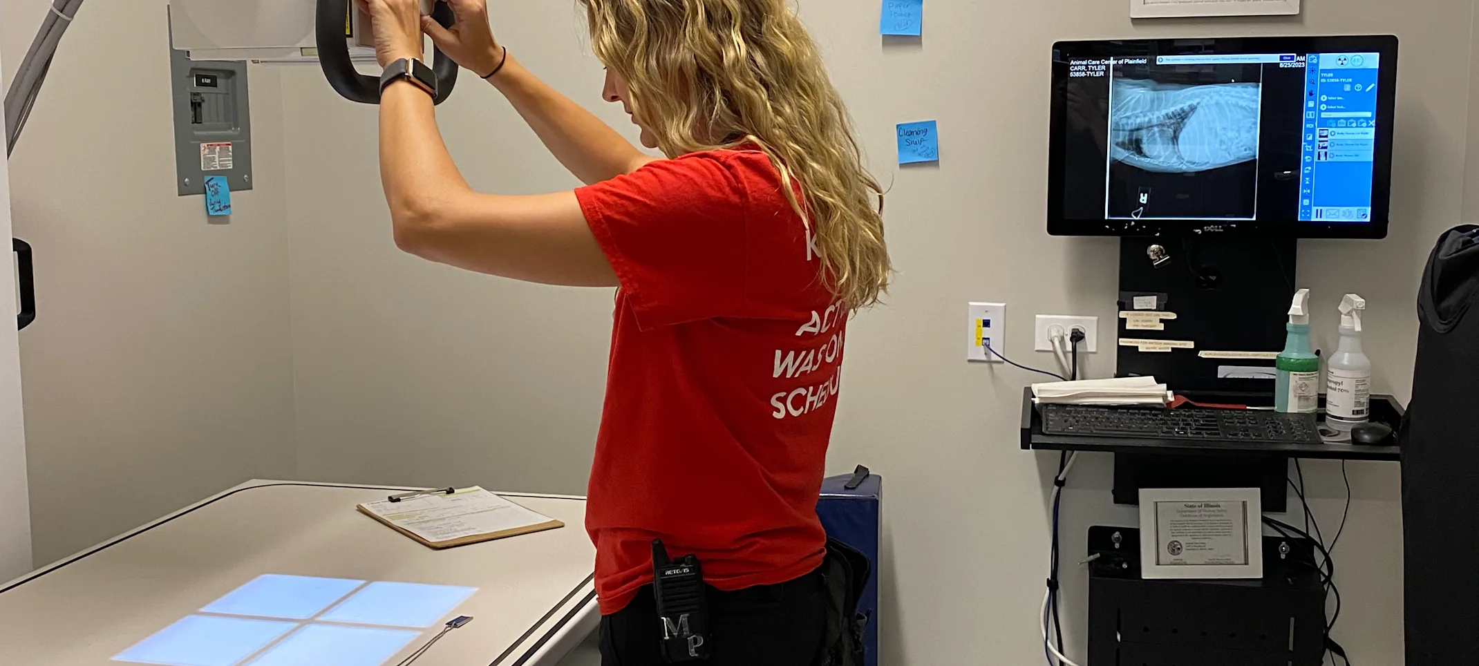 Staff member preparing the x-ray machine Staff member preparing the x-ray machine