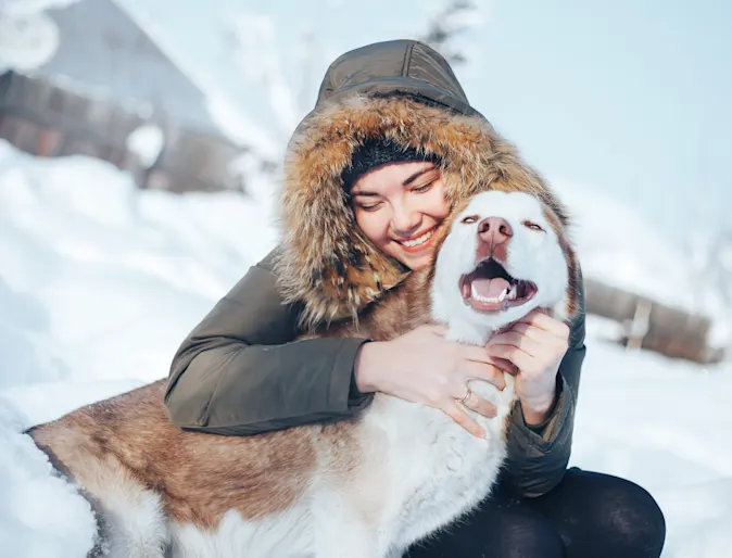 Dog and woman in the snow Dog and woman in the snow