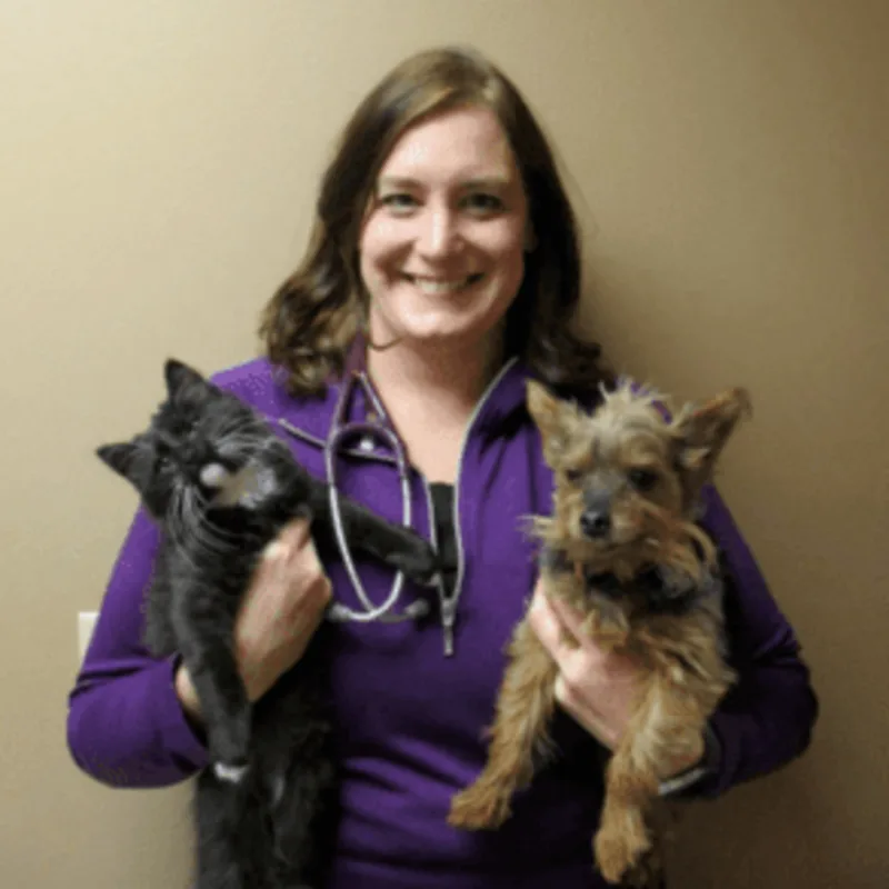 Dr. Jaleen Brunner-Flitz holding a cat and a dog Dr. Jaleen Brunner-Flitz holding a cat and a dog
